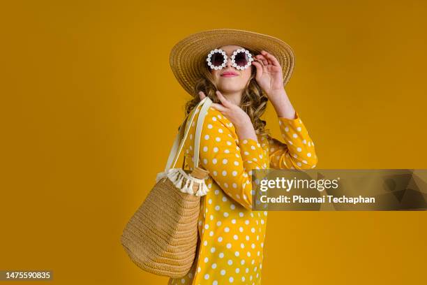 beautiful woman in yellow summer dress - one young woman only photos et images de collection