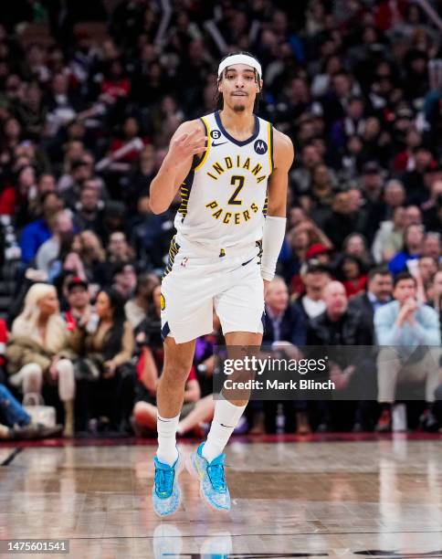 Andrew Nembhard of the Indiana Pacers celebrates his three point shot against the Toronto Raptors during the second half of their basketball game at...