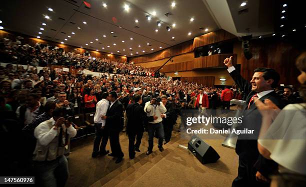 Presidential candidate Enrique Pena Nieto of the Institutional Revolutionary Party celebrates after polls show him ahead of Andres Manuel Lopez...