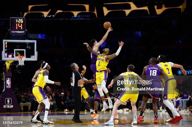 Landry Shamet of the Phoenix Suns and D'Angelo Russell of the Los Angeles Lakers in the second half at Crypto.com Arena on March 22, 2023 in Los...