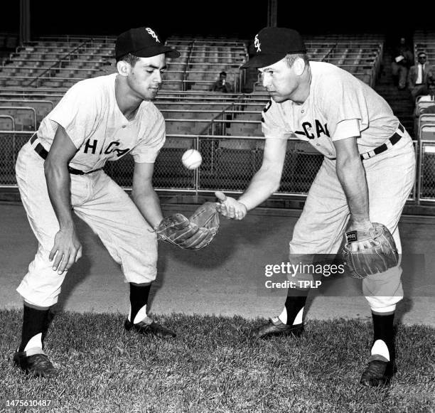 Shortstop Luis Aparicio and second baseman Nellie Fox, of the Chicago White Sox, play catch prior to an MLB game against the New York Yankees at...