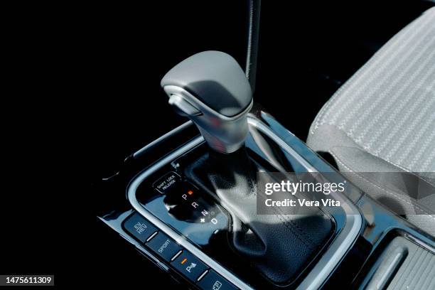 close-up view of hybrid car black gear stick interior with automatic driving shift - gear levers stock pictures, royalty-free photos & images