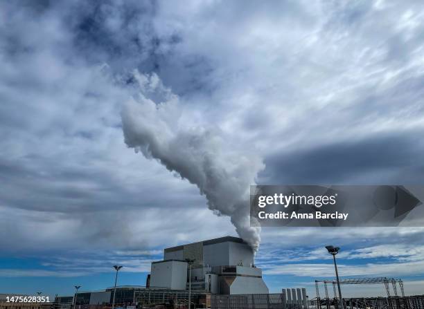 Steam leaves the Hinkley Point B power station as construction continues at Hinkley Point C on August 01, 2022 in Bridgwater, England. The first new...