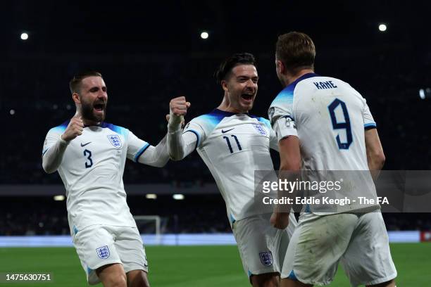 Harry Kane of England celebrates with team mates Luke Shaw and Jack Grealish of England after scoring their sides second goal during the UEFA EURO...