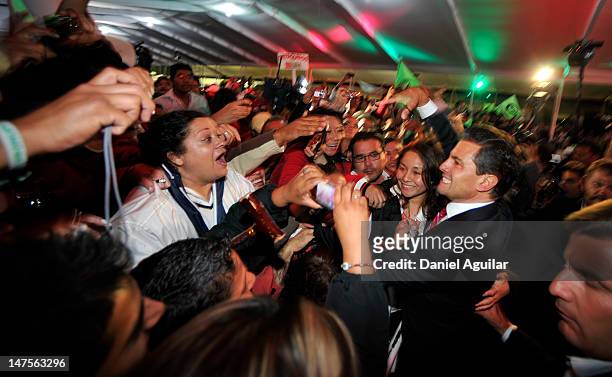 Presidential candidate Enrique Pena Nieto of the Institutional Revolutionary Party celebrates with supporters on July 2, 2012 in Mexico City, Mexico....
