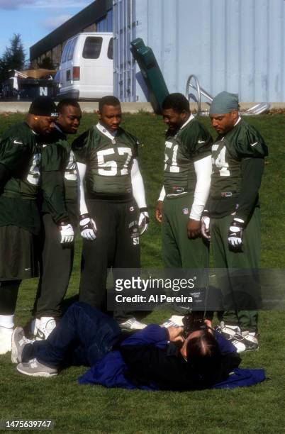 The New York Times Photographer Barton Silverman lays on his back to photograph New York Jets Linebackers including Marvin Jones, Mo Lewis, Bryan Cox...