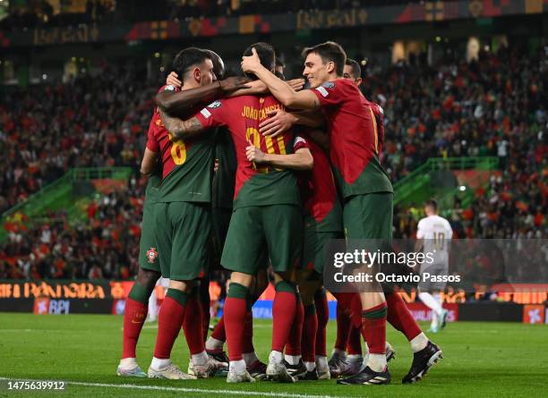 Bernardo Silva of Portugal celebrates with team mates after scoring their sides second goal during the UEFA EURO 2024 qualifying round group J match...