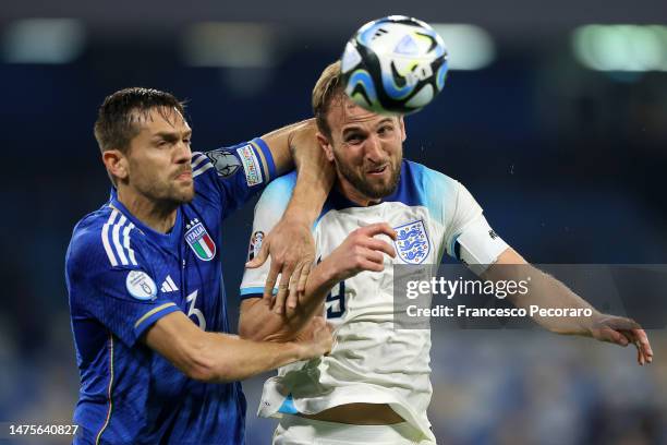 Harry Kane of England battles for possession with Rafael Toloi of Italy during the UEFA EURO 2024 qualifying round group C match between Italy and...