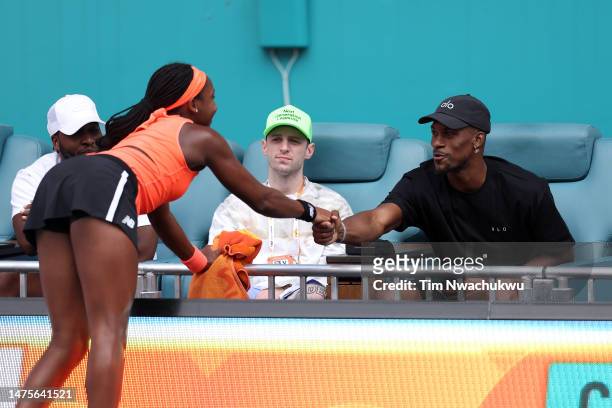 Jimmy Butler of the Miami Heat greets Coco Gauff of the United States during the Miami Open held at Hard Rock Stadium on March 23, 2023 in Miami...
