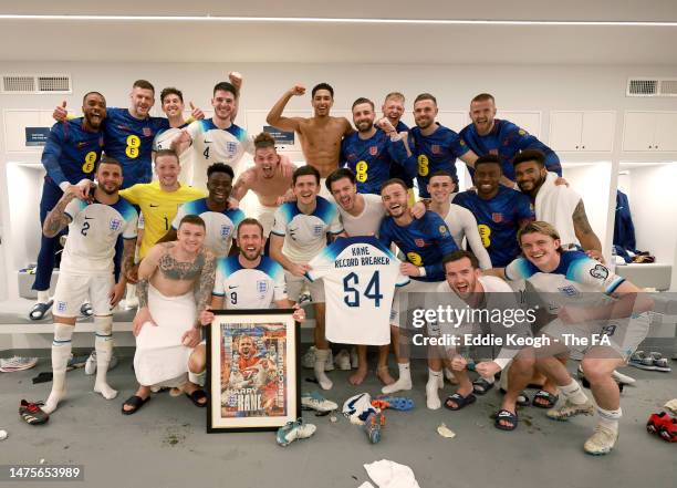 Harry Kane of England celebrates becoming England's all time record goal scorer with teammates in the England dressing room following the UEFA EURO...