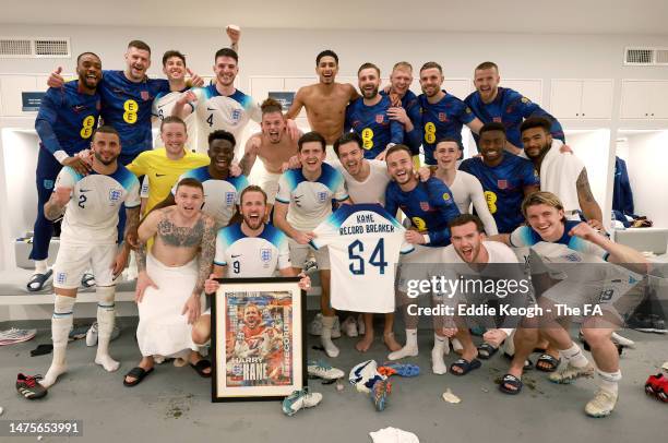 Harry Kane of England celebrates becoming England's all time record goal scorer with teammates in the England dressing room following the UEFA EURO...