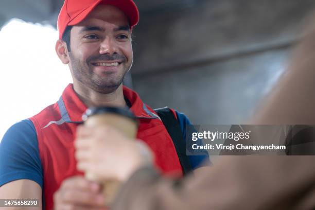 delivery man sending food delivery in office - fish finger stock pictures, royalty-free photos & images