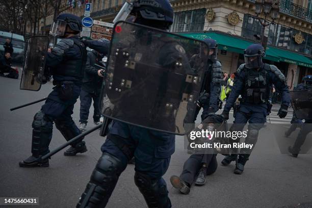 Riot police detain a protester during violent clashes over the government's reform of the pension system on March 23, 2023 in Paris, France. More...