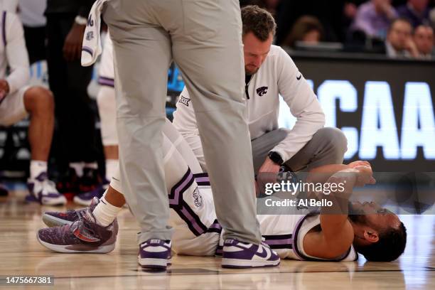 Markquis Nowell of the Kansas State Wildcats is looked over on the court after a play against the Michigan State Spartans during the second half in...