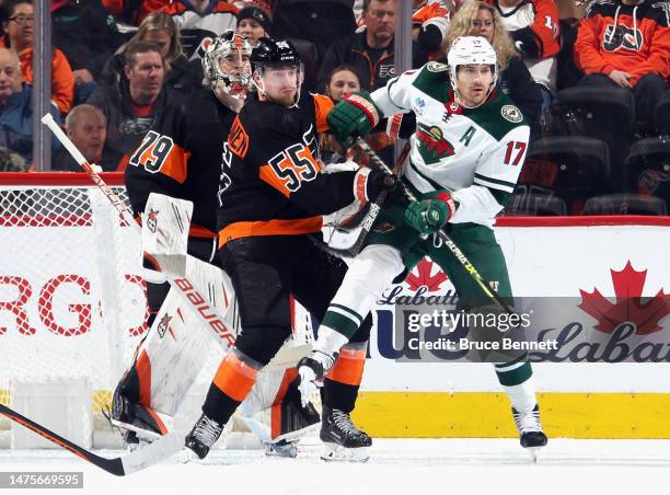 Rasmus Ristolainen of the Philadelphia Flyers and Marcus Foligno of the Minnesota Wild battle for position during the second period at the Wells...