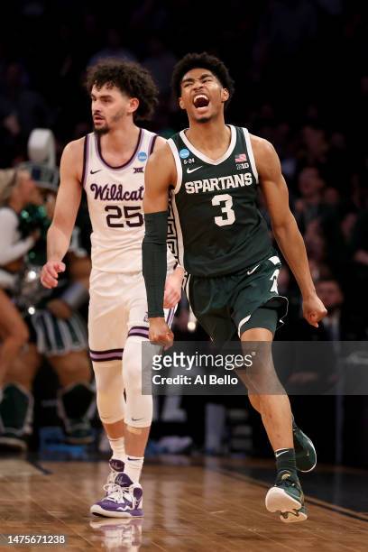 Jaden Akins of the Michigan State Spartans celebrates a basket against Ismael Massoud of the Kansas State Wildcats during the second half in the...