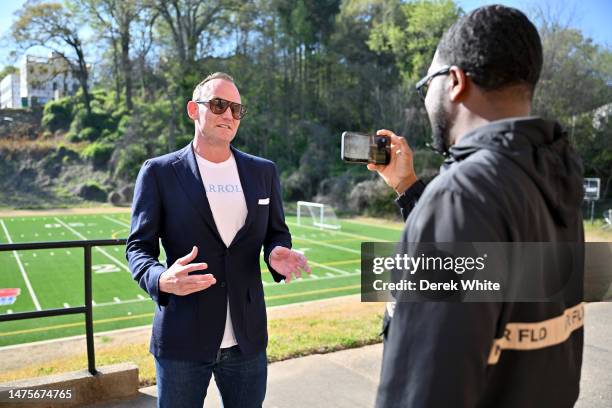 Malik Brown interviews Patrick Carroll during a sneaker giveaway at the Boys & Girls Club of Metro Atlanta on March 23, 2023 in Atlanta, Georgia.