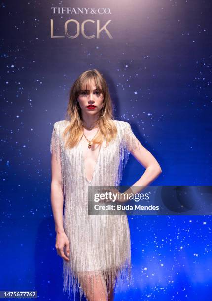 Singer Suki Waterhouse poses for pictures in front of the backdrop of the Tiffany & Co. Lock Festival at Jockey Club de Sao Paulo on March 23, 2023...