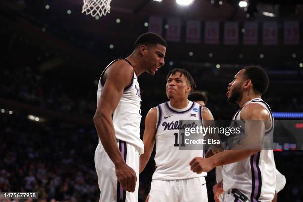 David N'Guessan, Keyontae Johnson and Markquis Nowell of the Kansas State Wildcats celebrate a basket against the Michigan State Spartans during...