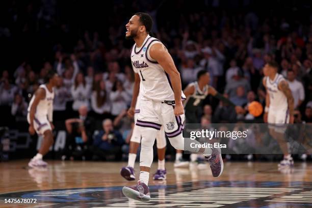 Markquis Nowell of the Kansas State Wildcats celebrates a basket against the Michigan State Spartans during overtime in the Sweet 16 round game of...