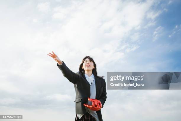 japanese high school girl playing baseball - high school baseball stock pictures, royalty-free photos & images