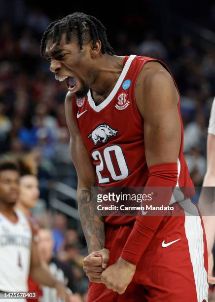 Kamani Johnson of the Arkansas Razorbacks reacts after a score during the second half against the Connecticut Huskies in the Sweet 16 round of the...