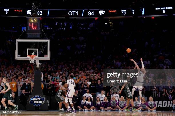 Ismael Massoud of the Kansas State Wildcats shoots the ball against Malik Hall of the Michigan State Spartans during overtime in the Sweet 16 round...