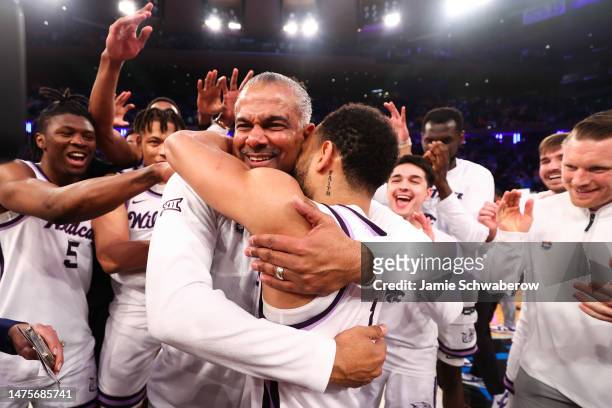 Head coach Jerome Tang of the Kansas State Wildcats hugs Markquis Nowell of the Kansas State Wildcats after defeating the Michigan State Spartans in...