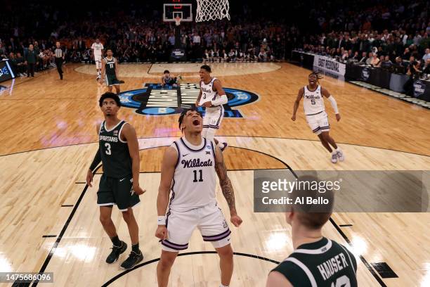 Keyontae Johnson of the Kansas State Wildcats celebrates after defeating the Michigan State Spartans in overtime in the Sweet 16 round game of the...