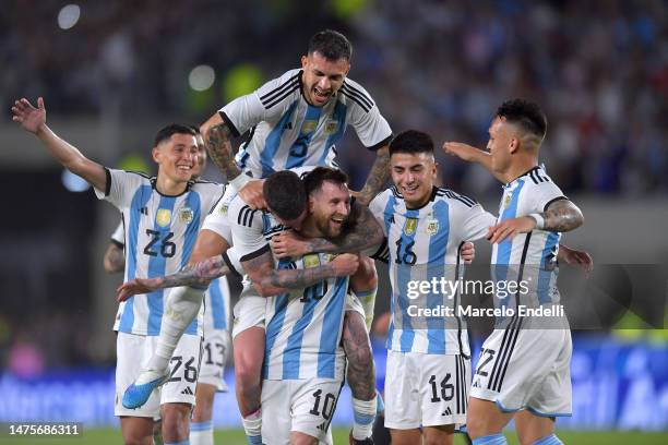 Lionel Messi of Argentina celebrates after scoring the team's second goal with teammates during an international friendly match between Argentina and...