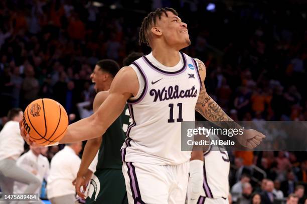 Keyontae Johnson of the Kansas State Wildcats celebrates after defeating the Michigan State Spartans in overtime in the Sweet 16 round game of the...