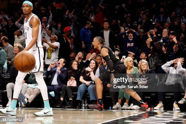 Isaac Okoro of the Cleveland Cavaliers reacts after hitting the game-winning basket during the second half against the Brooklyn Nets at Barclays...