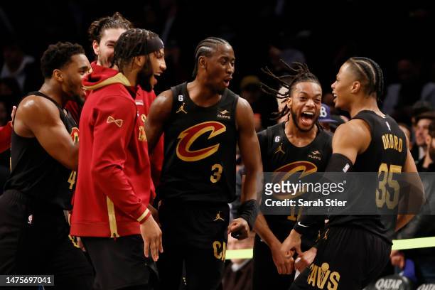 Isaac Okoro of the Cleveland Cavaliers reacts with teammates after hitting the game-winning basket during the second half against the Brooklyn Nets...