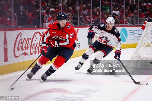 Nic Dowd of the Washington Capitals skates with the puck against Nick Blankenburg of the Columbus Blue Jackets during the second period of the game...