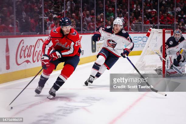 Nic Dowd of the Washington Capitals skates with the puck against Nick Blankenburg of the Columbus Blue Jackets during the second period of the game...