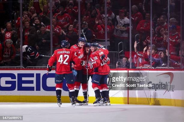 Conor Sheary of the Washington Capitals celebrates with teammates after scoring a goal against the Columbus Blue Jackets during the first period of...