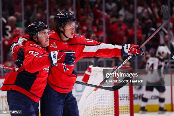 Sonny Milano of the Washington Capitals celebrates with T.J. Oshie after scoring a goal against the Columbus Blue Jackets during the second period of...