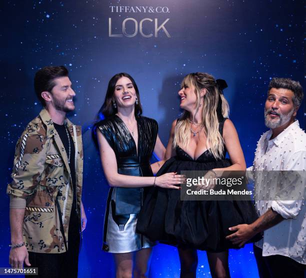 Actor Klebber Toledo, Camila Queiroz, Gio Ewbank and the actor Bruno Gagliasso pose for pictures in front of the backdrop of the Tiffany & Co. Lock...
