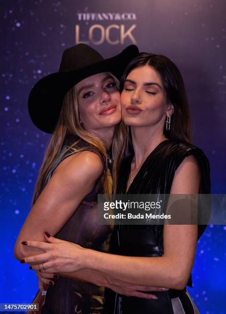 Model and influencer Valentina Ferrer pose for pictures with the actress Camila Queiroz in front of the backdrop of the Tiffany & Co. Lock Festival...