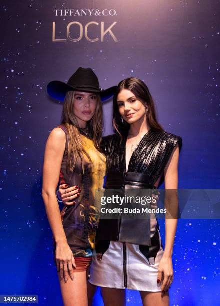 Model and influencer Valentina Ferrer pose for pictures with the actress Camila Queiroz in front of the backdrop of the Tiffany & Co. Lock Festival...