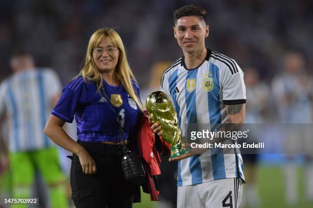 Gonzalo Montiel of Argentina poses for a photo with the FIFA World Cup trophy during the World Champions' celebrations after an international...