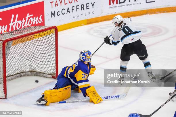 Zach Benson of the Winnipeg ICE slides the puck past goaltender Ethan Chadwick of the Saskatoon Blades for a third period goal at Wayne Fleming Arena...