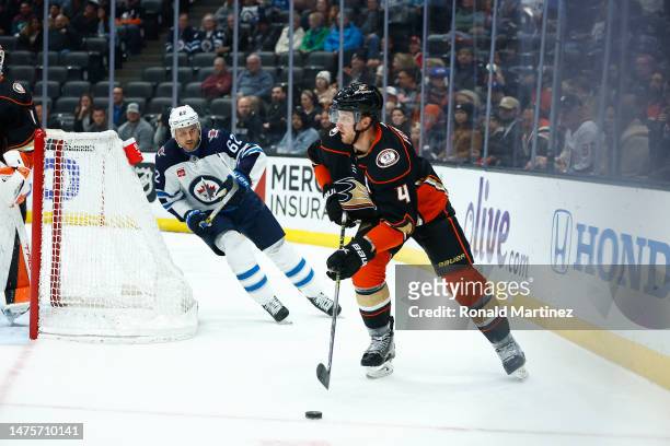 Cam Fowler of the Anaheim Ducks skates the puck against the Winnipeg Jets in the first period at Honda Center on March 23, 2023 in Anaheim,...