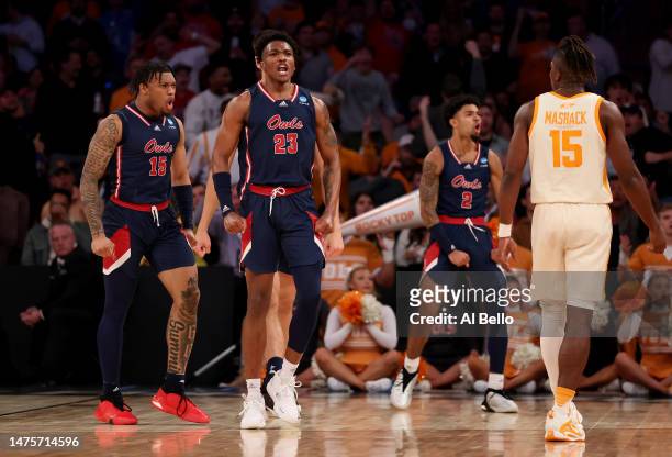 Alijah Martin, Brandon Weatherspoon and Nicholas Boyd of the Florida Atlantic Owls celebrate a basket against the Tennessee Volunteers during the...
