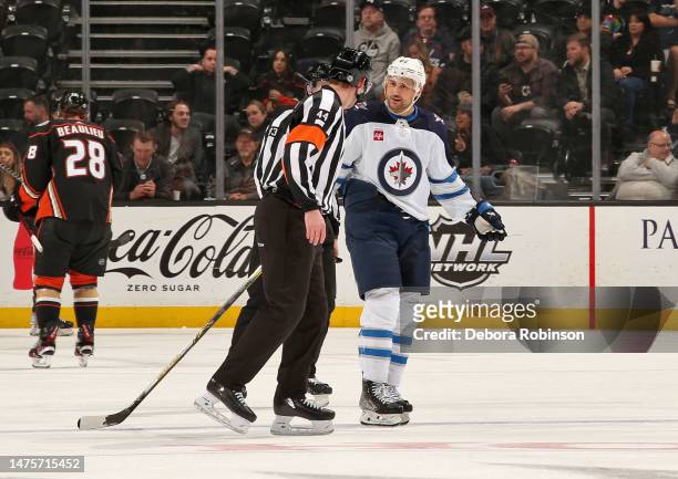Nino Niederreiter of the Winnipeg Jets talks with referee Justin Kea during the first period of the game between the Winnipeg Jets and the Anaheim...