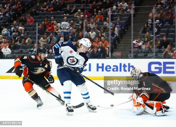 Kyle Connor of the Winnipeg Jets takes a shot against Lukas Dostal of the Anaheim Ducks in the first period at Honda Center on March 23, 2023 in...
