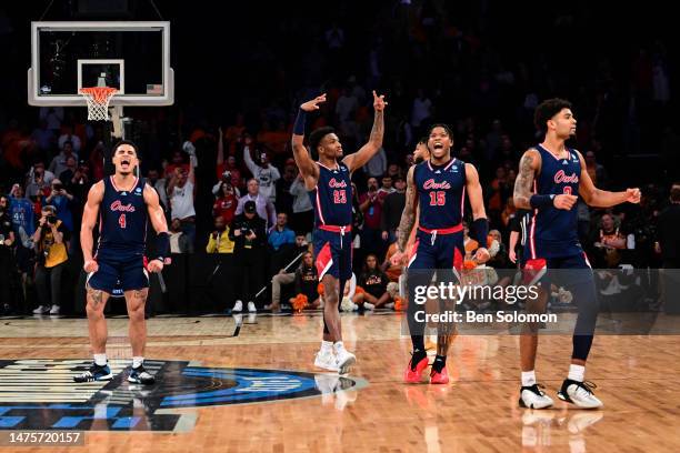 The Florida Atlantic Owls celebrate after defeating the Tennessee Volunteers during the Sweet Sixteen round of the 2023 NCAA Men's Basketball...