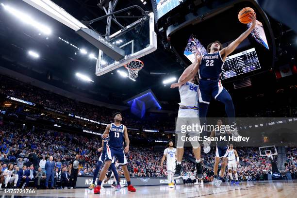 Anton Watson of the Gonzaga Bulldogs grabs the rebound against Jaime Jaquez Jr. #24 of the UCLA Bruins during the second half in the Sweet 16 round...