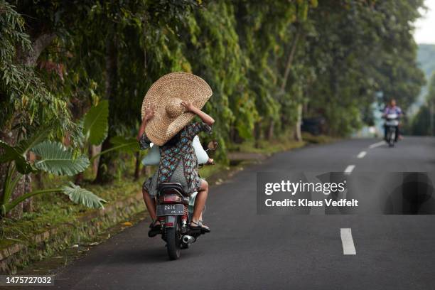 women traveling through scooter on road - camel active fotografías e imágenes de stock