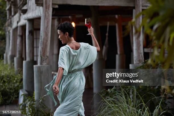 smiling woman having fun at resort - bali dancing stock pictures, royalty-free photos & images